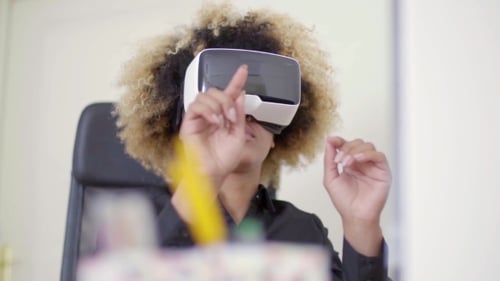Businesswoman Working In Virtual Reality In Office