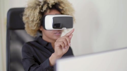 Woman with VR Headset Interacting with Technology