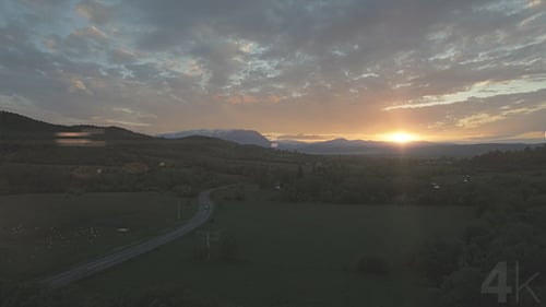 Spring Sunset Over the Mountains and River