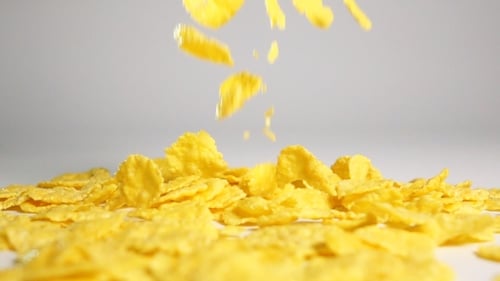 Cornflakes Fall On White Surface