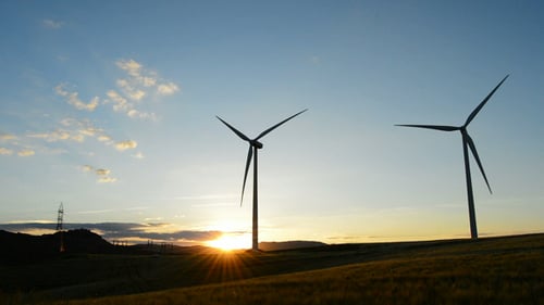 Wind Turbines Silhouetted at Beautiful Sunset