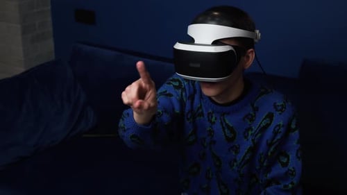 Young Adult Using Virtual Reality Headset at Home
