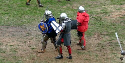 Medieval Swordsmen Fight With Swords and Shields