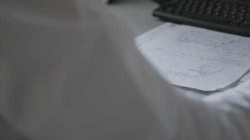 Man Works In Office - Uses Mouse And Computer