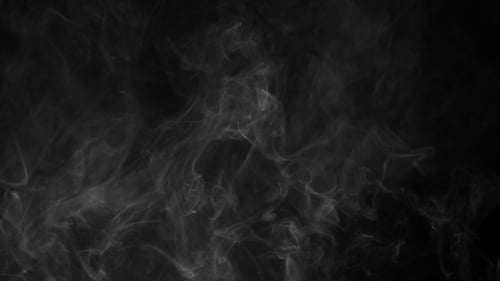 Swirling White Smoke on Black Background