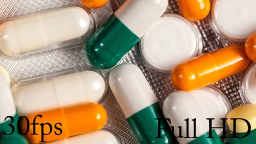 Many Pills And Capsules On Table