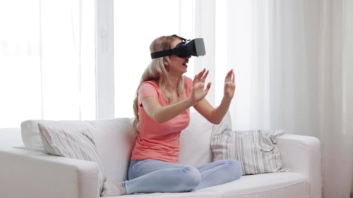 Woman Experiencing Virtual Reality Headset at Home