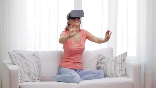 Woman Experiencing Virtual Reality Headset at Home