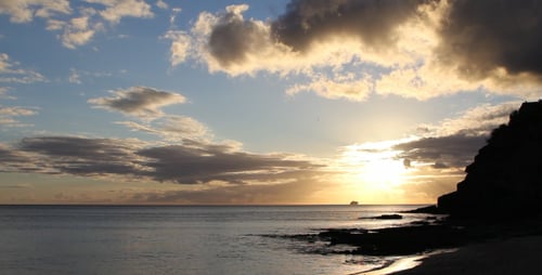 Golden Sunrise over Tropical Beach and Ocean