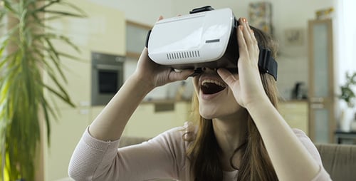 Woman Experiencing Virtual Reality With VR Headset