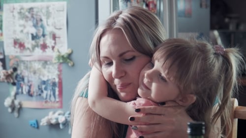 Mother And Girl Eating Cheese Then Hugging And Kissing