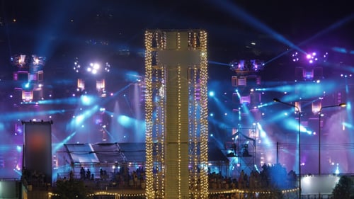 Nighttime Concert Stage with Crowd and Lights