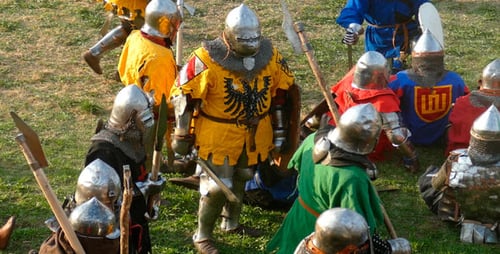 Armored Combatants Gather on Grassy Field