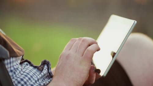 Man Using Tablet Outdoor.