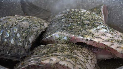 Seasoned Fish Cooking in a Pan