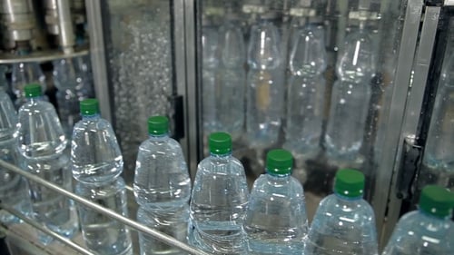 Bottling Water on Production Line in Factory