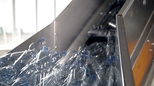 Plastic Bottles on Recycling Factory Conveyor Belt