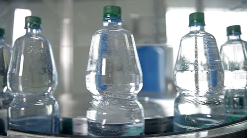 Water Bottles on Conveyor Belt in Factory