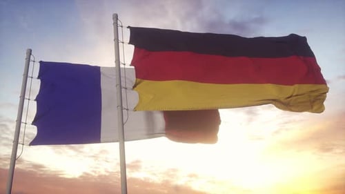 France and Germany Flags Waving at Sunset