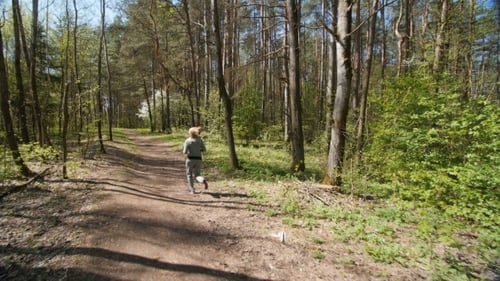Young Lady Running On a Rural Road.