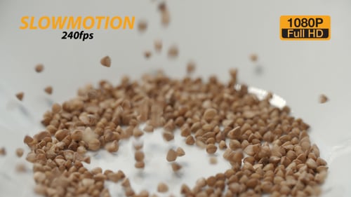 Buckwheat Grains Falling into White Bowl, Food Footage