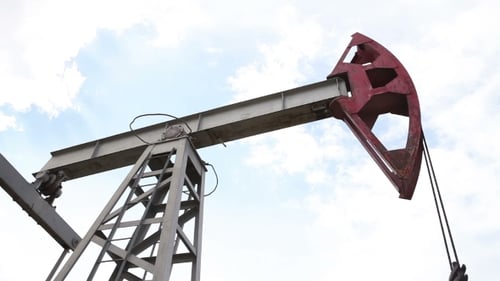 Working Pumpjack Extracting Oil in Rural Area