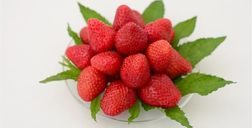 Fresh Red Strawberries with Mint on Plate