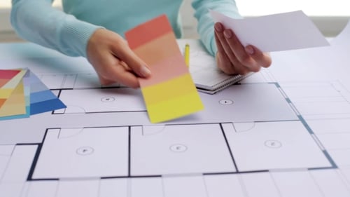 Woman With Blueprint And Swatches Choosing Color 51