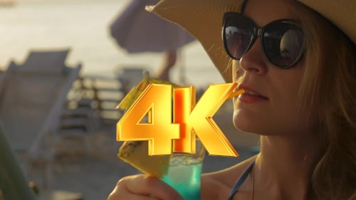 Woman In Hat And Sunglasses Drinking Cocktail