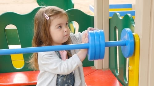 Happy Toddler Girl On The Playground