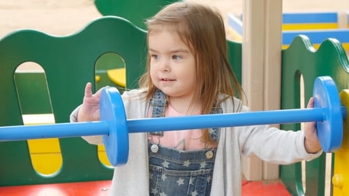 Happy Toddler Girl On The Playground