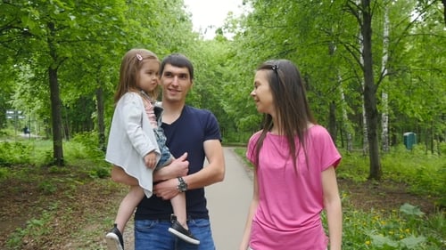 Happy Family On The Walk In Forest