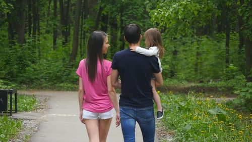 Happy Family On The Walk In Forest