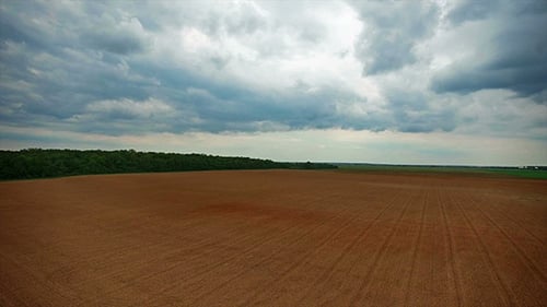 Flying Over A Plowed Field