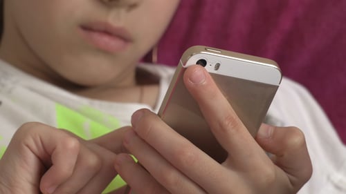 Child Typing on Mobile Phone, Close Up