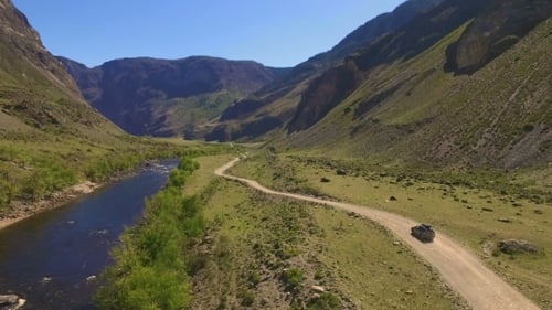 Car On a Winding Road In The Mountains
