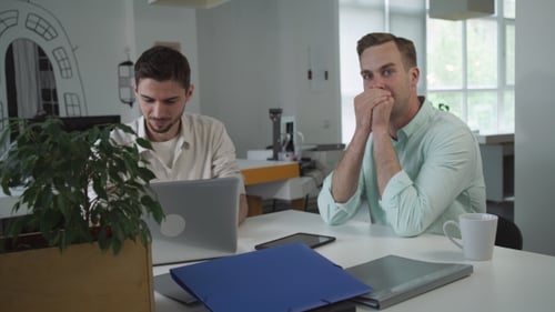 Two Young Workers Writing Funny Story For Stand-up Comedy.