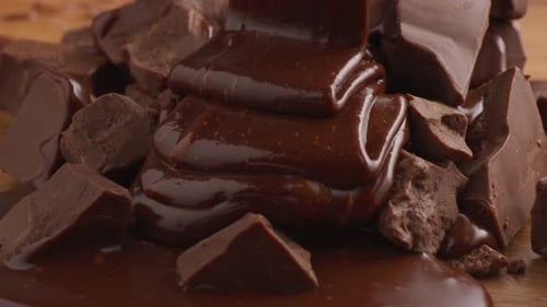Decadent Melted Chocolate Being Poured on Chocolate Chunks