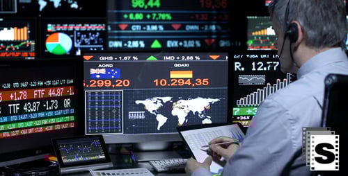 Stock Market Analyst Working With Multiple Screens