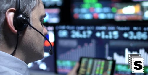 Man Analyzing Financial Data in Modern Office