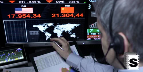 Market Analyst Studying International Financial Data