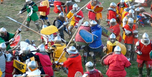Medieval Battle Reenactment with Armored Knights Clashing