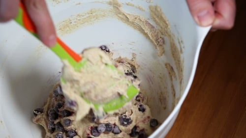 Blueberry Muffin Batter Being Mixed in Bowl