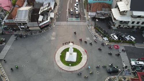 Aerial view of Tugu Yogyakarta Landmark with busy traffic.