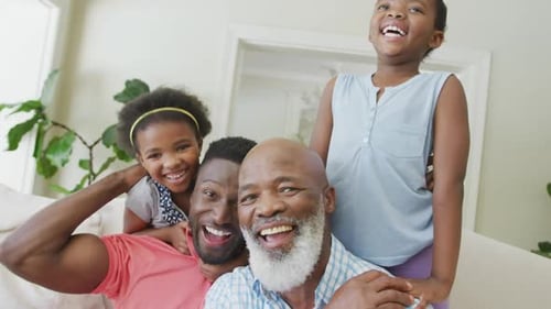 Happy Family Smiling and Laughing Together Indoors