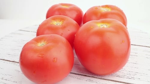 Red Ripe Tomatoes on a White Table