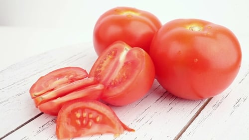 Fresh Tomatoes Sliced on a Wooden Surface