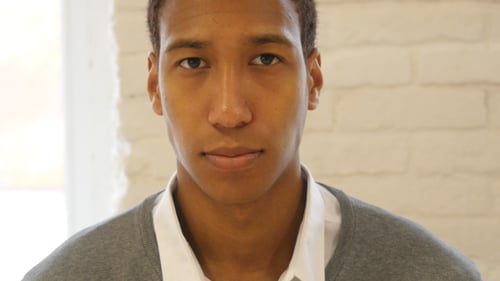 Close Up Portrait of Serious Young Adult Man