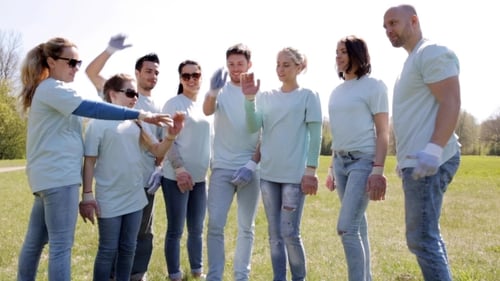 Group Of Volunteers Putting Hands On Top In Park 30