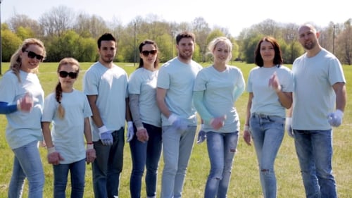 Group Of Volunteers Showing Thumbs Up In Park 14